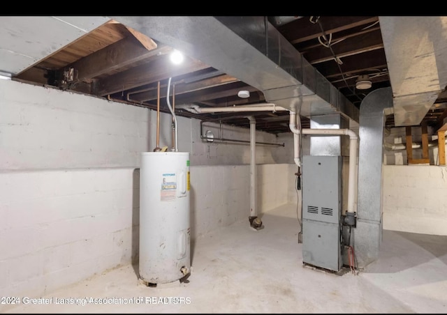 basement featuring heating unit and water heater