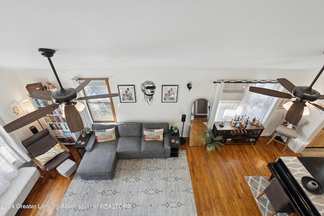 living room with ceiling fan and wood-type flooring