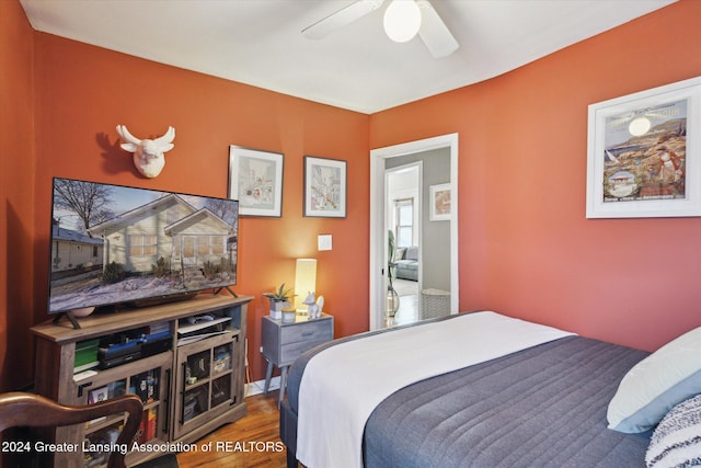 bedroom featuring hardwood / wood-style flooring and ceiling fan