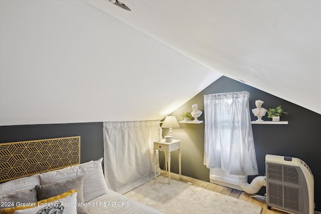 bathroom featuring vaulted ceiling