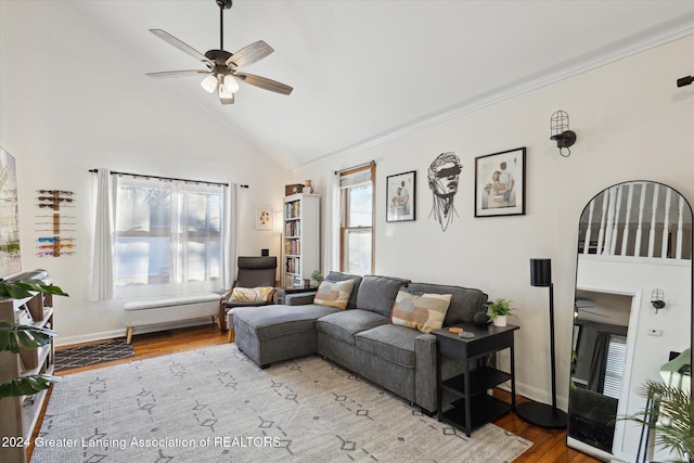 living room featuring light wood-type flooring, high vaulted ceiling, a wealth of natural light, and ceiling fan