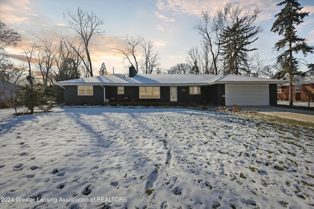 ranch-style home with a garage