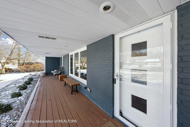 view of snow covered deck