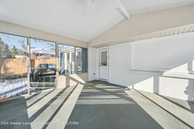 sunroom featuring lofted ceiling with beams and ceiling fan