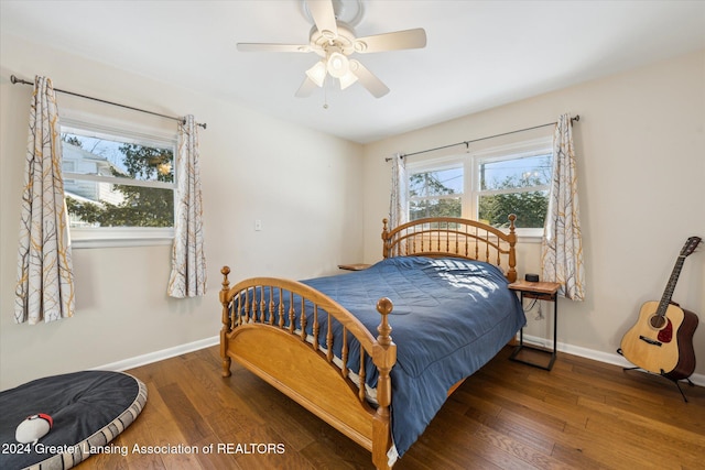 bedroom featuring ceiling fan and dark hardwood / wood-style floors