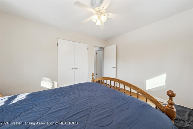 bedroom with ceiling fan and a closet