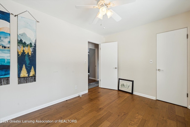 unfurnished room with hardwood / wood-style floors and ceiling fan