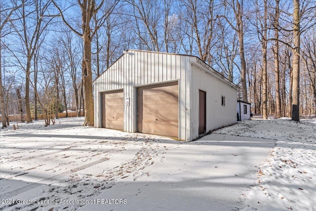 view of snow covered garage