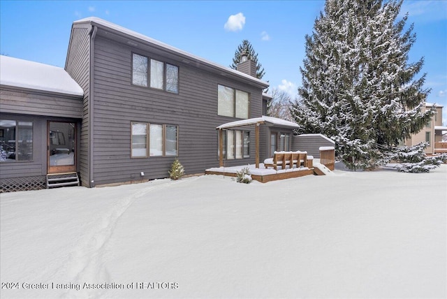 view of snow covered property