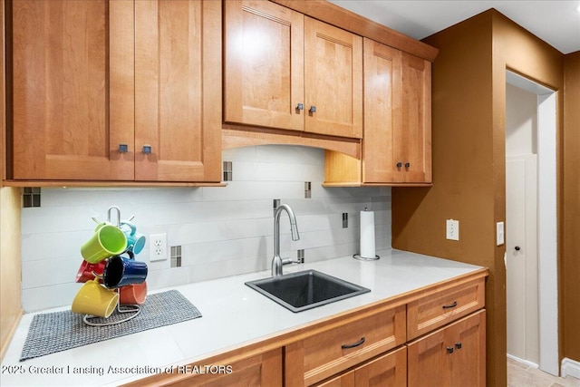 kitchen featuring sink and backsplash