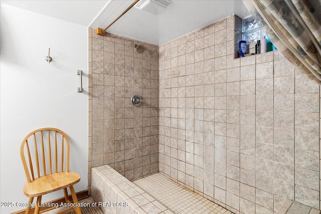 bathroom featuring tiled shower