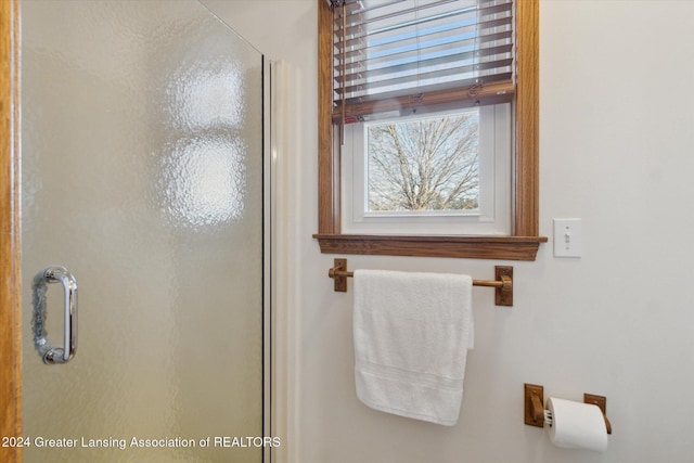 bathroom featuring an enclosed shower