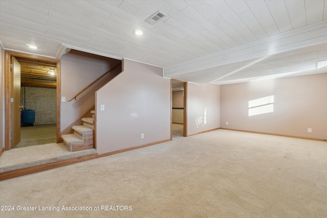 basement with carpet flooring and wood ceiling