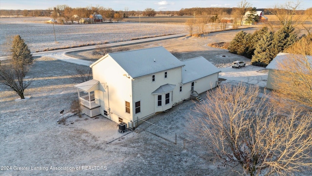 birds eye view of property with a rural view