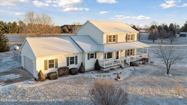 view of front of house with covered porch and a garage