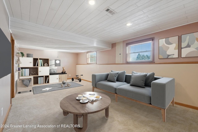 living room featuring light colored carpet and wooden ceiling