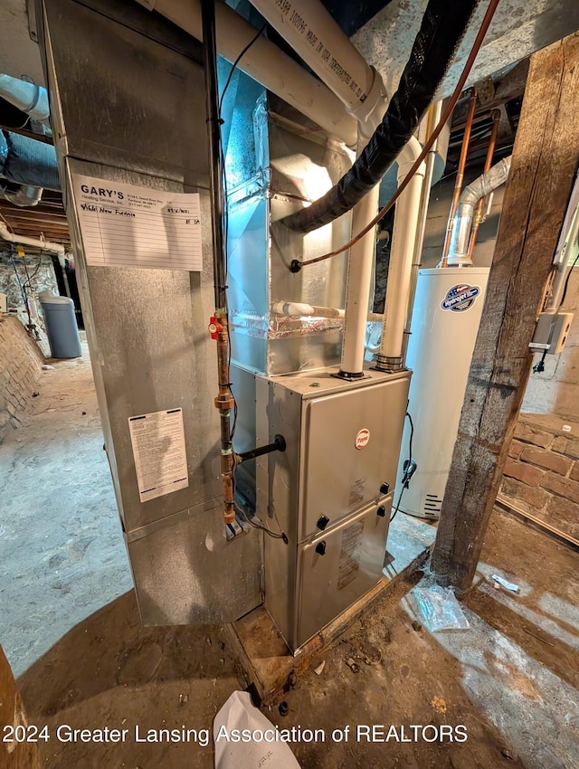 utility room with gas water heater