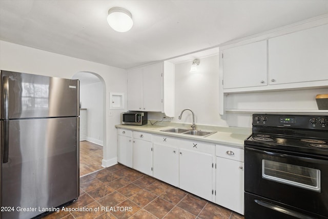 kitchen featuring sink, white cabinets, and stainless steel appliances