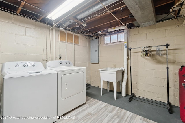 laundry area with washer and clothes dryer and electric panel