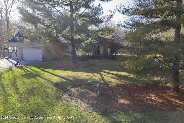 view of yard featuring a garage