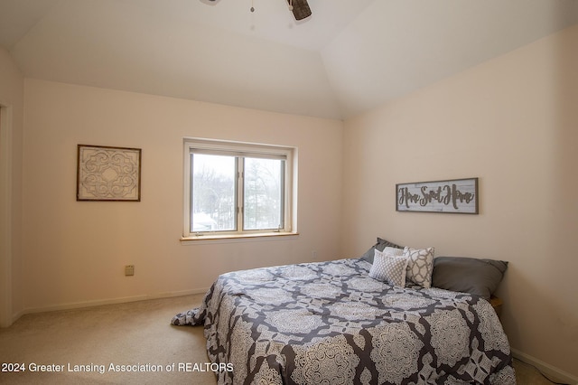 bedroom featuring ceiling fan, lofted ceiling, and carpet