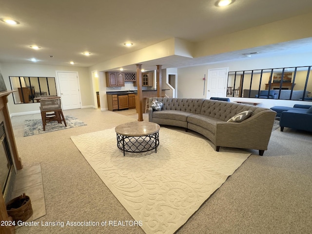 carpeted living room featuring bar