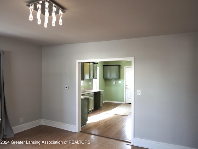 spare room with hardwood / wood-style floors