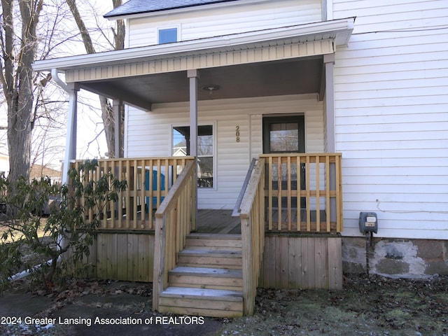 property entrance featuring covered porch