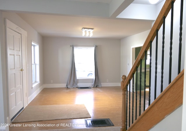 foyer entrance with light wood-type flooring