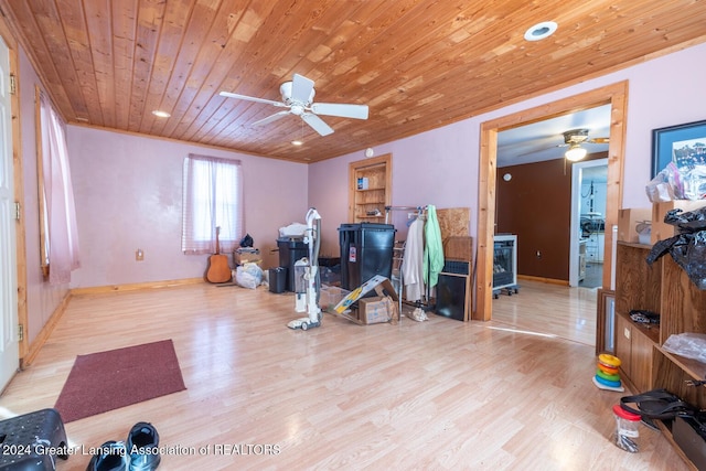 workout room with light hardwood / wood-style flooring, ceiling fan, and wooden ceiling