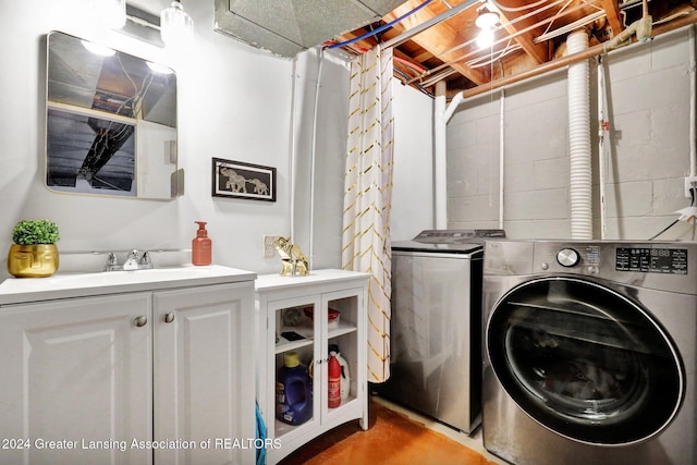 laundry room featuring sink and washer and dryer