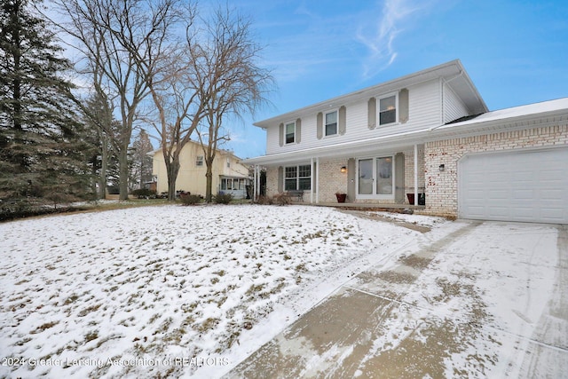 front of property with a garage