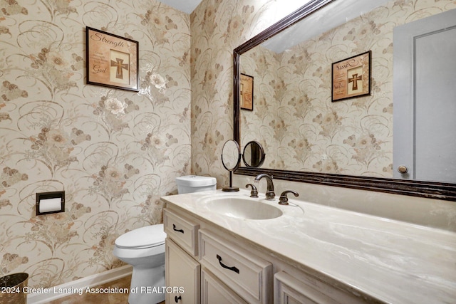 bathroom featuring vanity and toilet