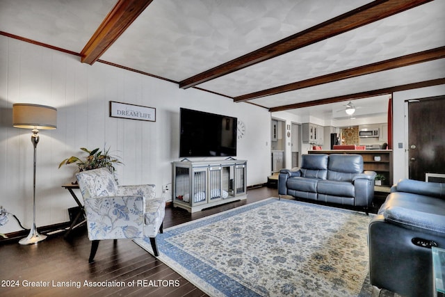 living room with beamed ceiling and dark hardwood / wood-style floors