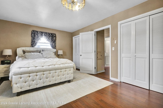 bedroom featuring vaulted ceiling and hardwood / wood-style floors