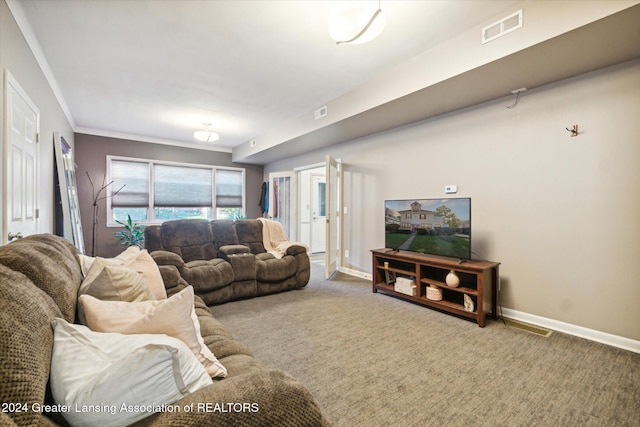 living room featuring carpet floors and crown molding