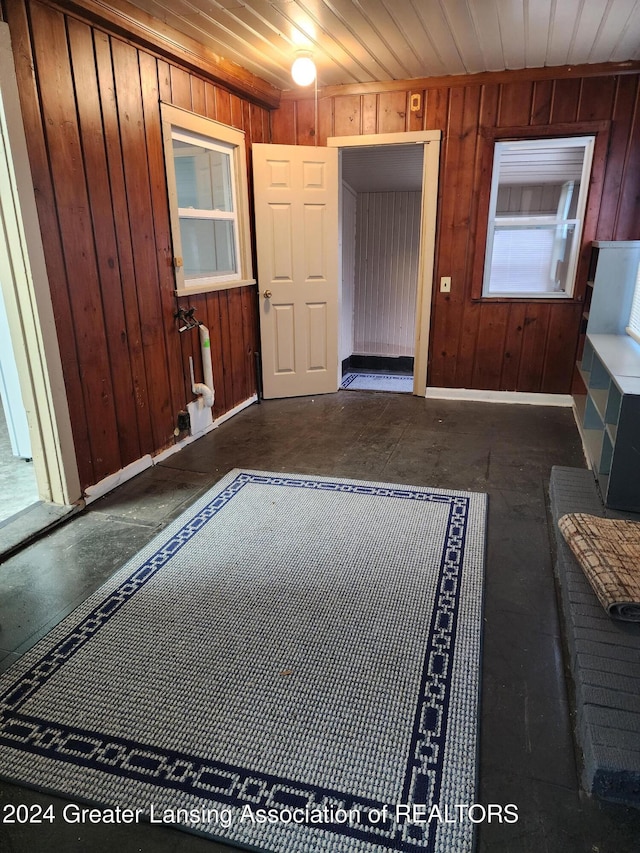 entryway with wooden walls