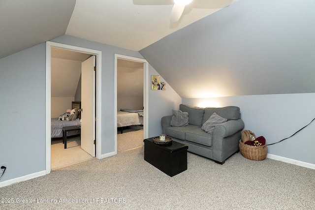 carpeted living room featuring lofted ceiling and ceiling fan