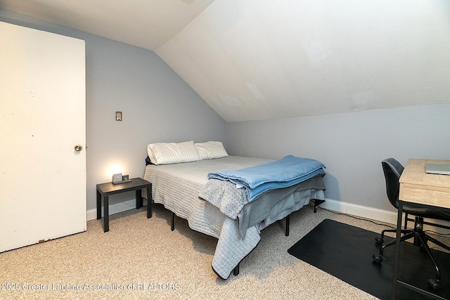 carpeted bedroom with vaulted ceiling