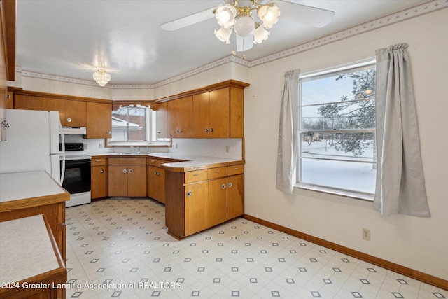 kitchen featuring white appliances, ceiling fan, and sink