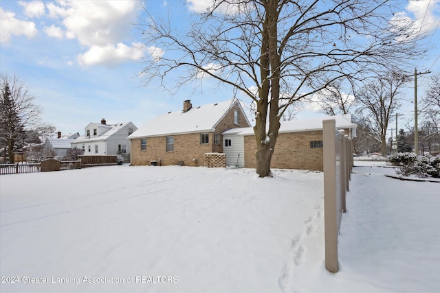 view of snow covered house