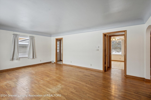 spare room with hardwood / wood-style flooring