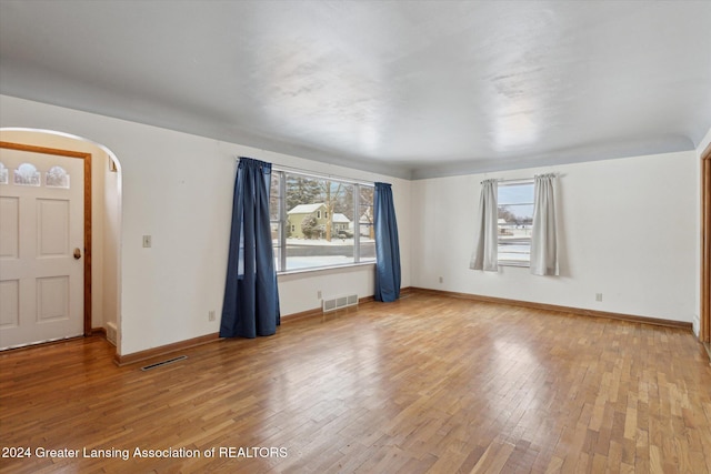 empty room featuring hardwood / wood-style floors