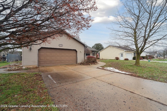 view of side of home featuring a garage