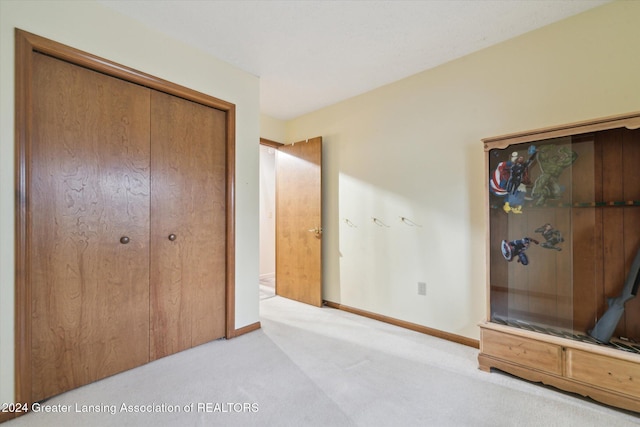 carpeted bedroom featuring a closet