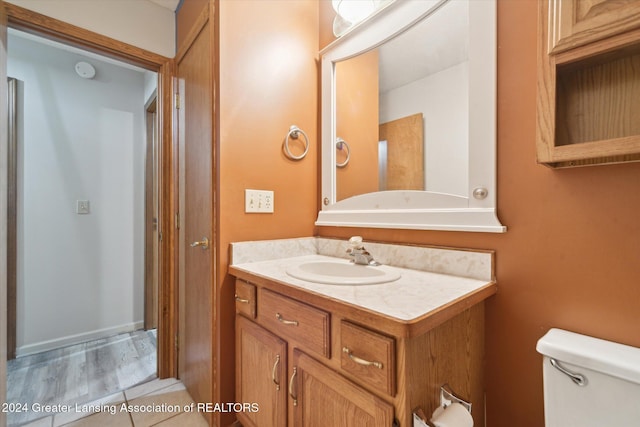 bathroom with vanity and toilet