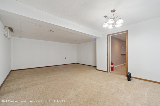 interior space featuring an inviting chandelier and carpet floors