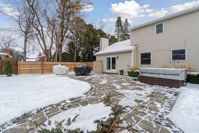 exterior space with a hot tub