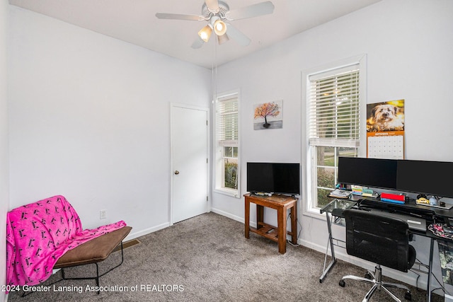 carpeted office featuring ceiling fan