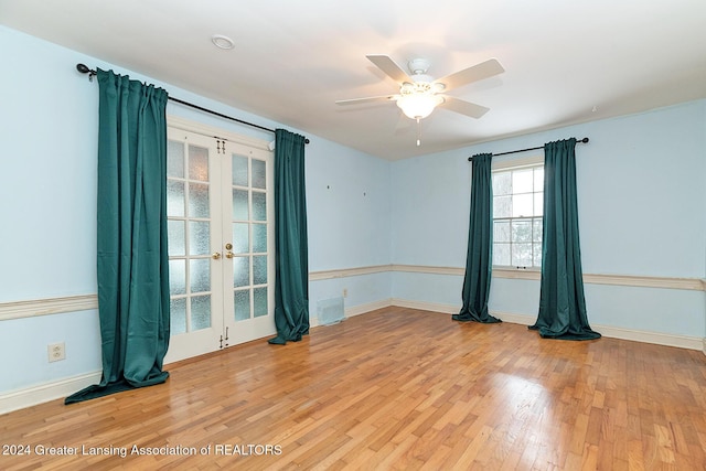 unfurnished room featuring ceiling fan, wood-type flooring, and french doors